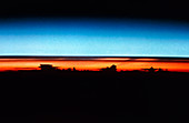 Sunrise seen from Shuttle w/clouds in silhouette