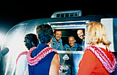 Apollo 11 crew greeting wives from quarantine unit