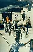 Apollo 11 crew arriving aboard the recovery ship