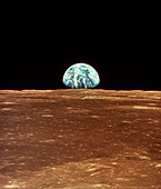 Apollo 11 view of Earth rising over Moon's horizon