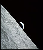 Apollo 17 image of a crescent earthrise over moon