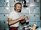Skylab 3 astronaut eating