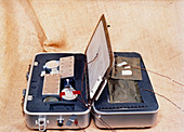 Suitcase cooker for use on the Space Shuttle
