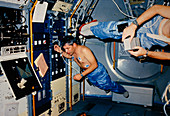 Astronaut demonstrating weightlessness on shuttle