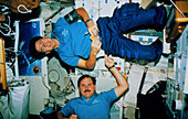 Shuttle astronauts demonstrate zero-gravity