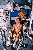 Astronauts Henricks & Runco working out,STS-44