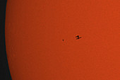 Silhouette of ISS against the Sun