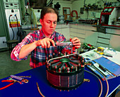 Technician assembling a solid polymer fuel cell