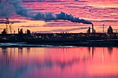 Oil refinery at sunset