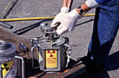 Opening a radioactive container