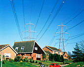 Power cables and pylons over homes