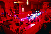 Scientist observing beam from tunable dye laser