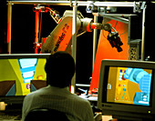 Technician working with the ROTEX robot arm