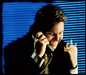 Businessman talking on a telephone in an office