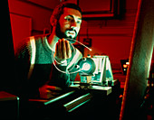 Scientist holding optical fibre