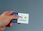 Hand holding a smart card
