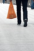 Shopper carrying food shopping