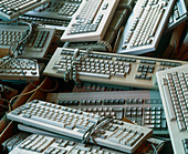 Piles of discarded,redundant computer keyboards