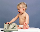 Baby with computer keyboard