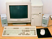Computer and peripherals on an office desk