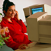 Secretary working at an office computer