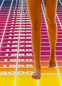 Computer abstract of woman's legs and time grid