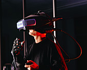 Researcher wearing virtual reality helmet & glove