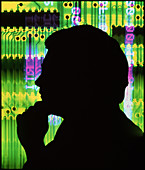 Silhouette of man against circuit board