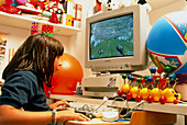 Young girl using a brain-activated computer system