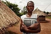 Holding a radio,Uganda