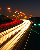 Light trails from vehicles on motorway at night
