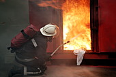 Firefighter extinguishing a fire
