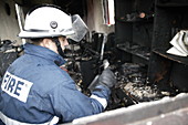 Firefighter in a burnt-out house