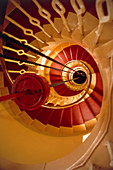 View down lighthouse stairs showing lantern weight