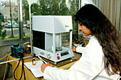 Chemist with laboratory scales