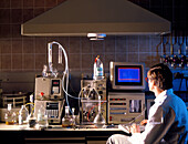 Scientist using HPLC equipment in a research lab