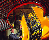 Worker inspects a moulded plastic wheel fender