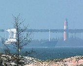 Cargo ship and lighthouse, superior mirage