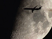 Aeroplane passing in front of the Moon