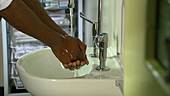 Male doctor washing his hands