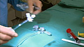 Doctor preparing surgical equipment