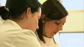 Female pathologists working in the lab