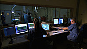 Technicians in theatre control room