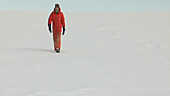 Researcher walking in Antarctica