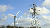 Timelapse of wind turbine and pylon