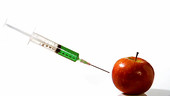 Syringe thrown at an apple