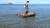 Fisherman on a raft