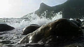 Waves washing over camera