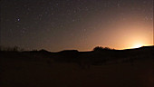 Moonrise over sand dunes, timelapse