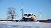 Wind turbines towering over farms